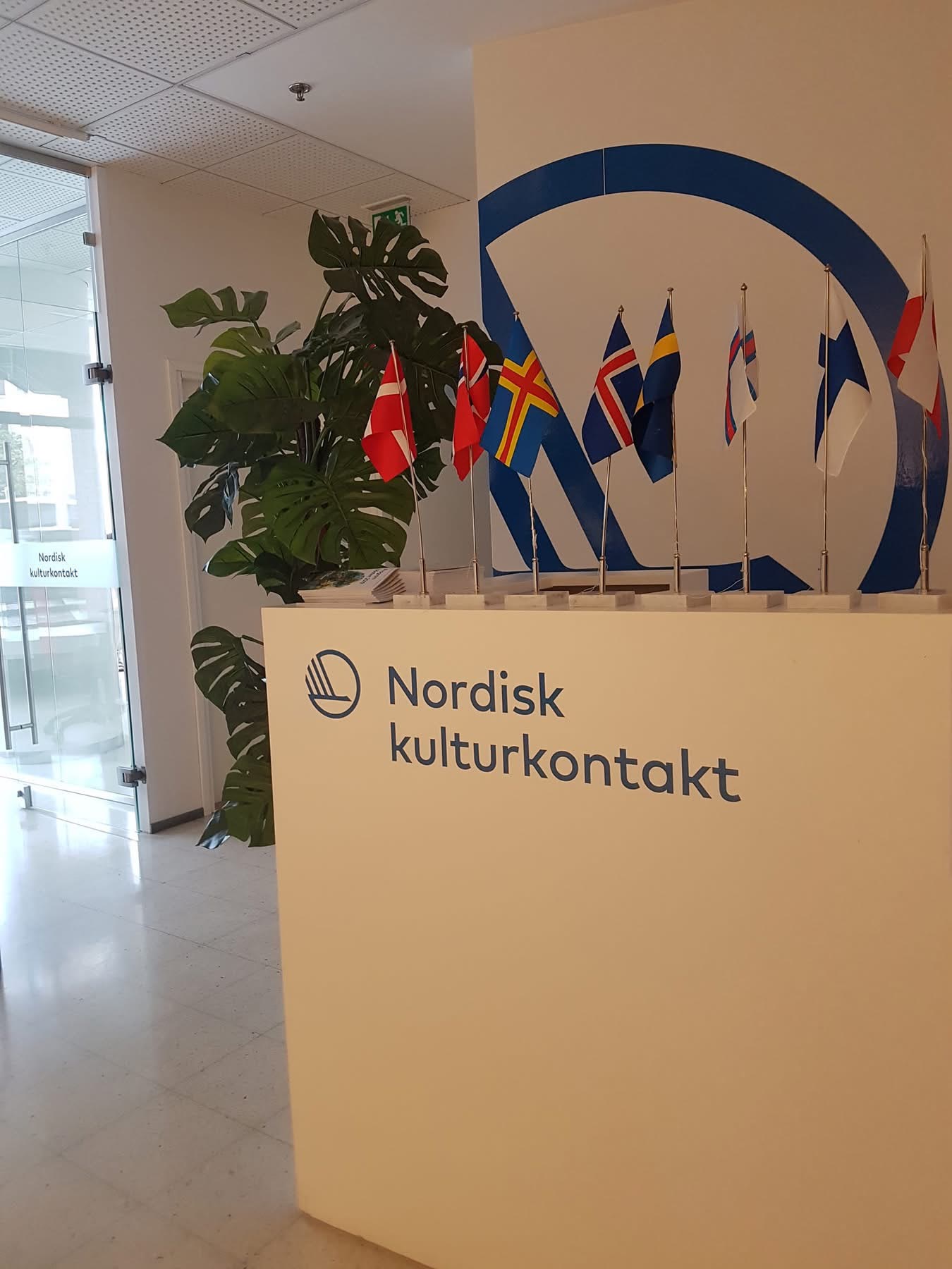 Nordic Culture Point reception in Helsinki with Nordic flags.