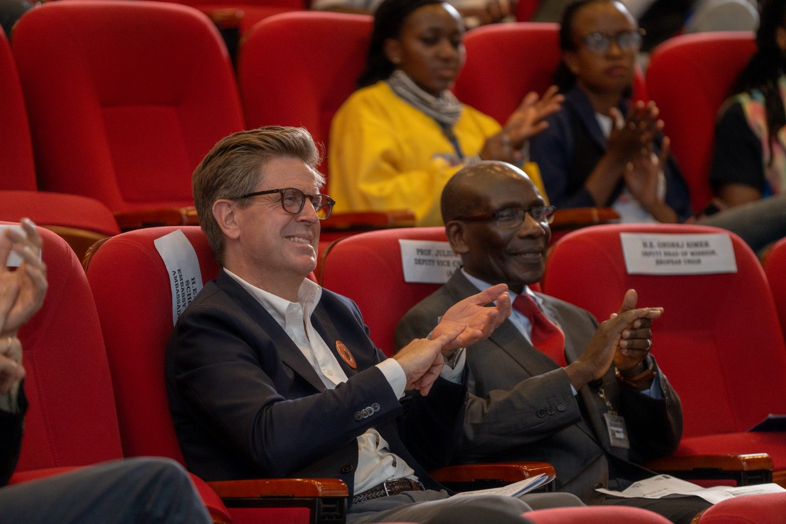 H.E. Stephan Schønemann and Vice Chancellor Prof. Julius Ogeng’o watching the performance at the University of Nairobi as part of Silenced No More.